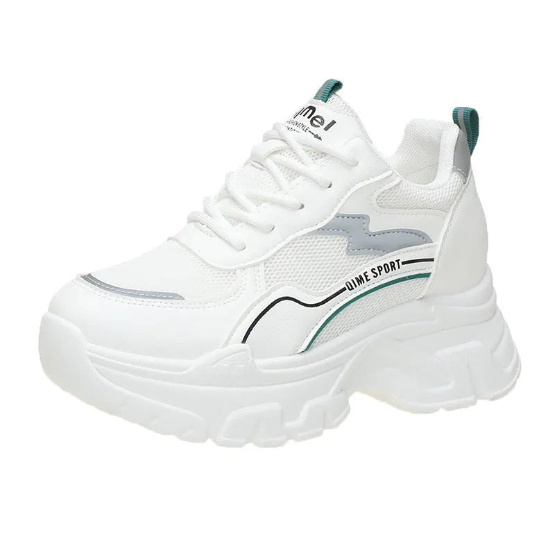 Beige women's lace-up dad shoes with cross straps and a round toe, on a white background.