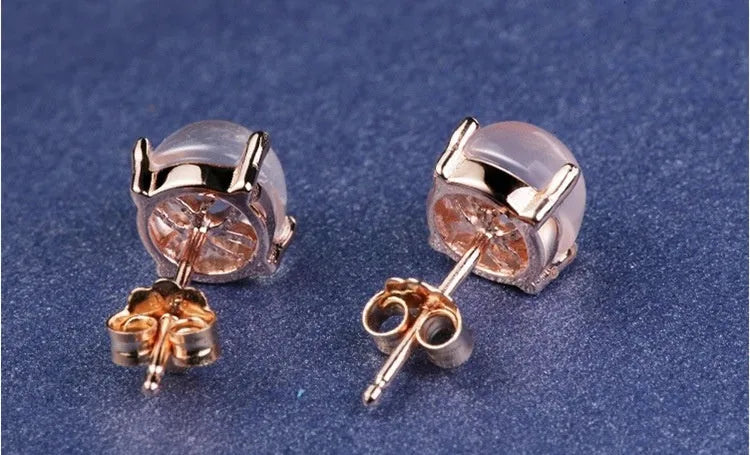 Rose gold drop shape stud earrings with synthetic ross quartz crystal inlay, Korean style.