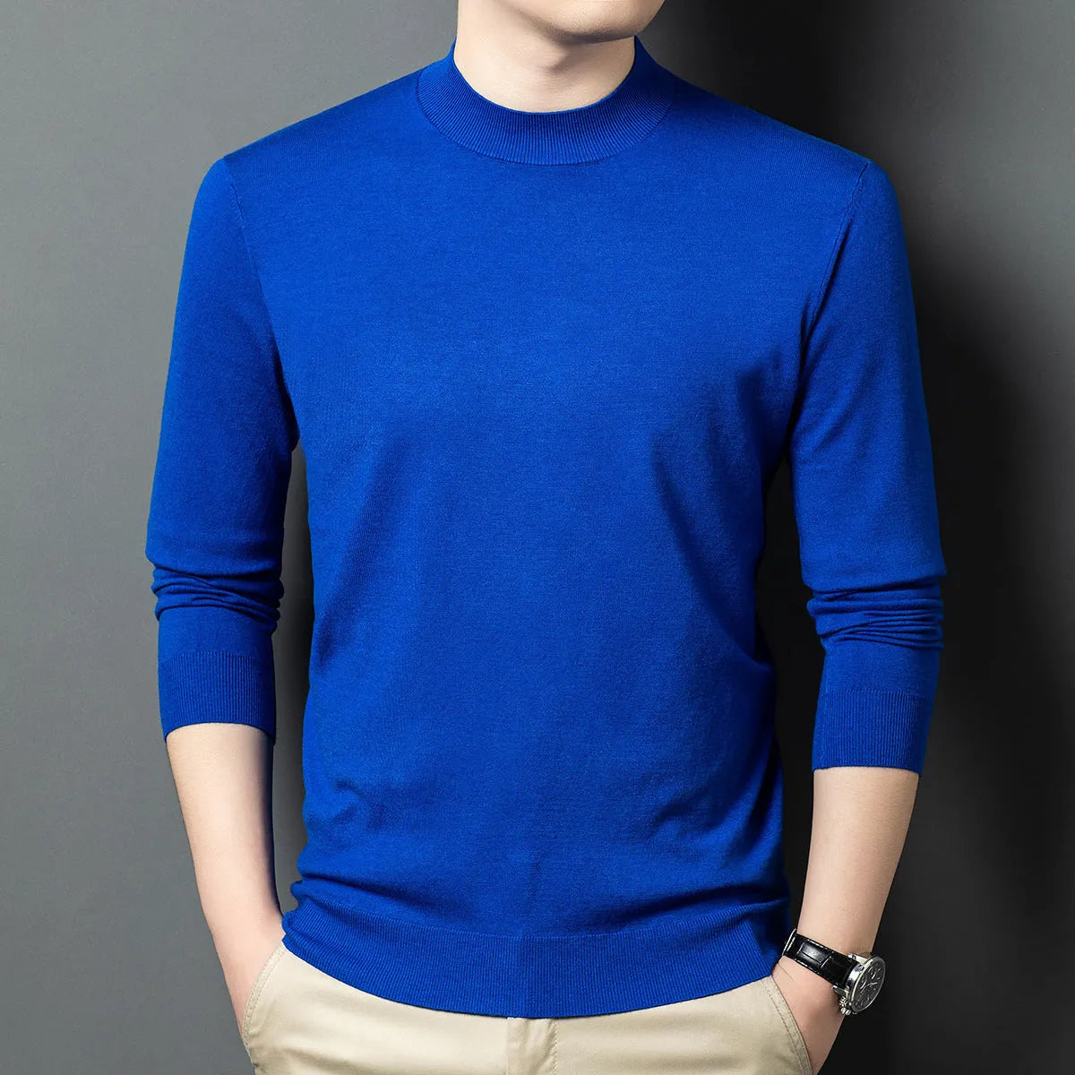 Men's round neck grey wool blend pullover sweater with long sleeves on a hanger.