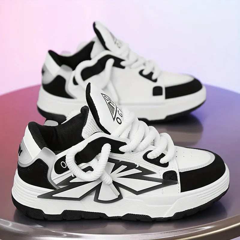 Men's white chunky sneakers with a cartoon totem pattern on the synthetic leather upper and a thick rubber sole.