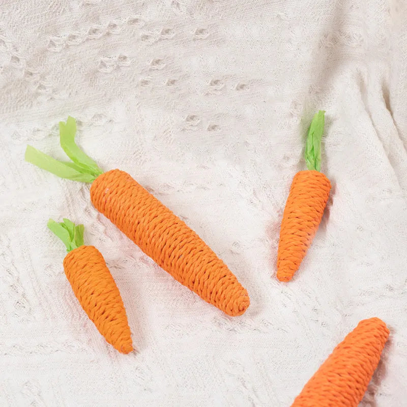 Cat toys with paper carrot shapes containing ringing stones for dental care and interactive play