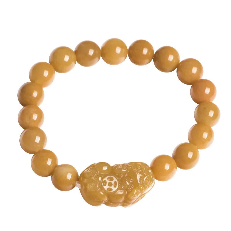 Carved Jinsi Jade money bracelet showing golden thread patterns in natural stone