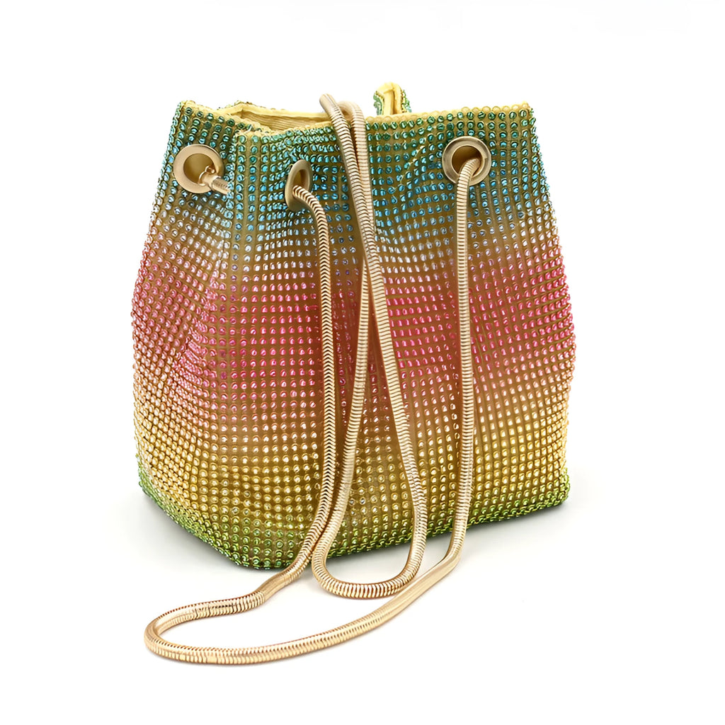 Soft rainbow-coloured rhinestone bucket bag with a silver chain shoulder strap on a white background.