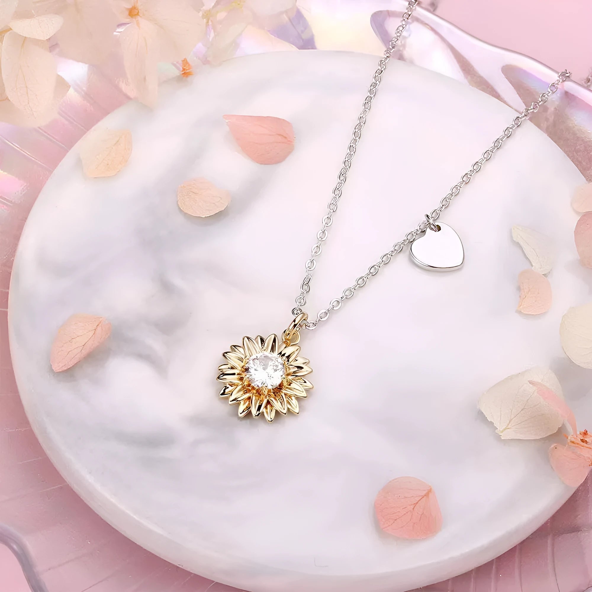 Sterling silver sunflower necklace with adjustable chain on white background
