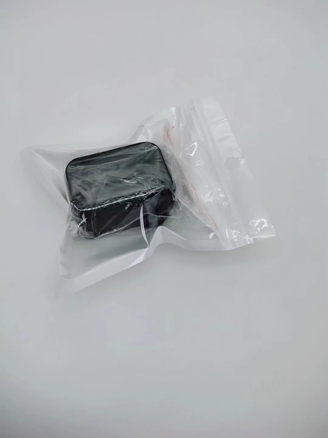 Black and red plastic seat belt buckle clamp holders for automotive use