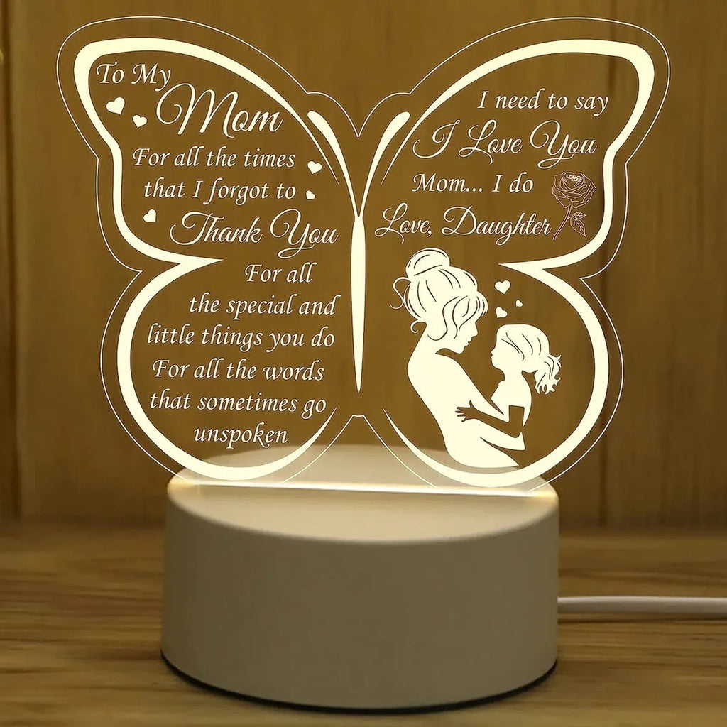 White heart-shaped table lamp with touch control and USB power cable on wooden surface