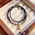 Handmade multi-layer women's bracelet in blue sand colour with three rings and stone-cut beads.
