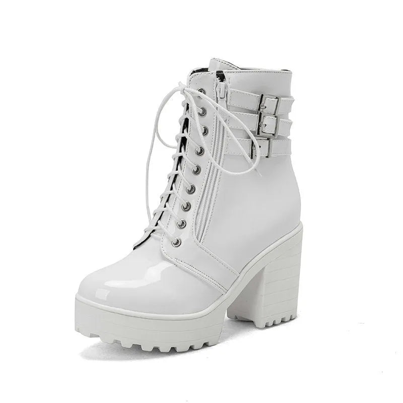 Women's black thick-heeled lace-up ankle boots with a round toe and rubber sole on a waterproof platform.