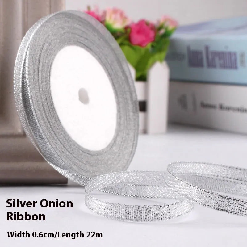 Roll of polyester gift ribbon showing 0.6cm width and multiple colour options including metallic finishes