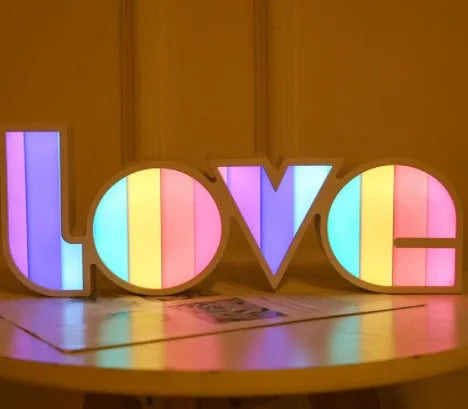 Rainbow style LED LOVE light decoration with plastic shell measuring 35.5cm by 13.5cm