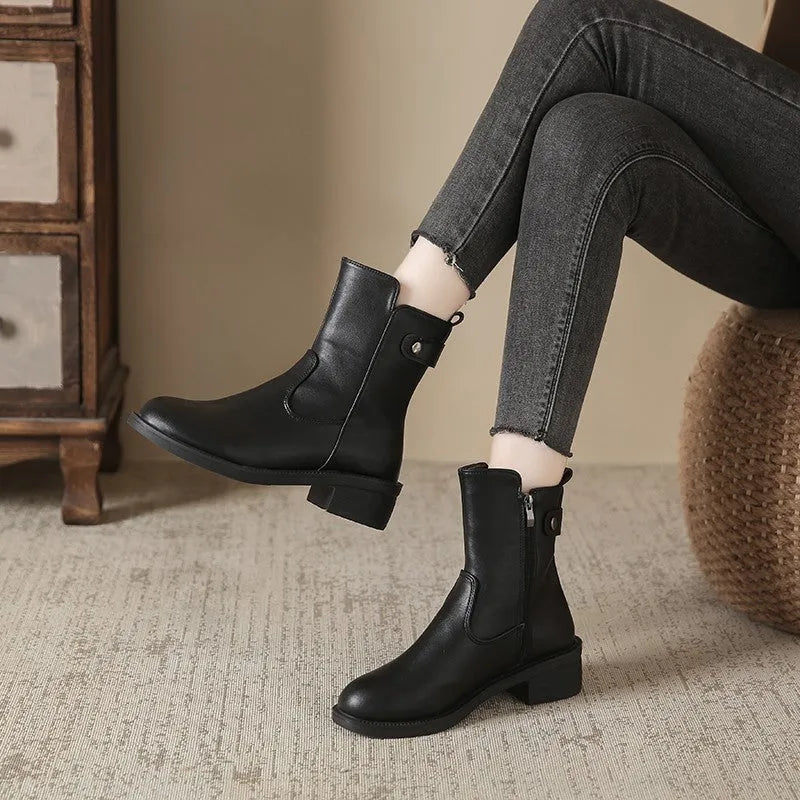 Black women's low heel side zip ankle boots with round toe on a white background.