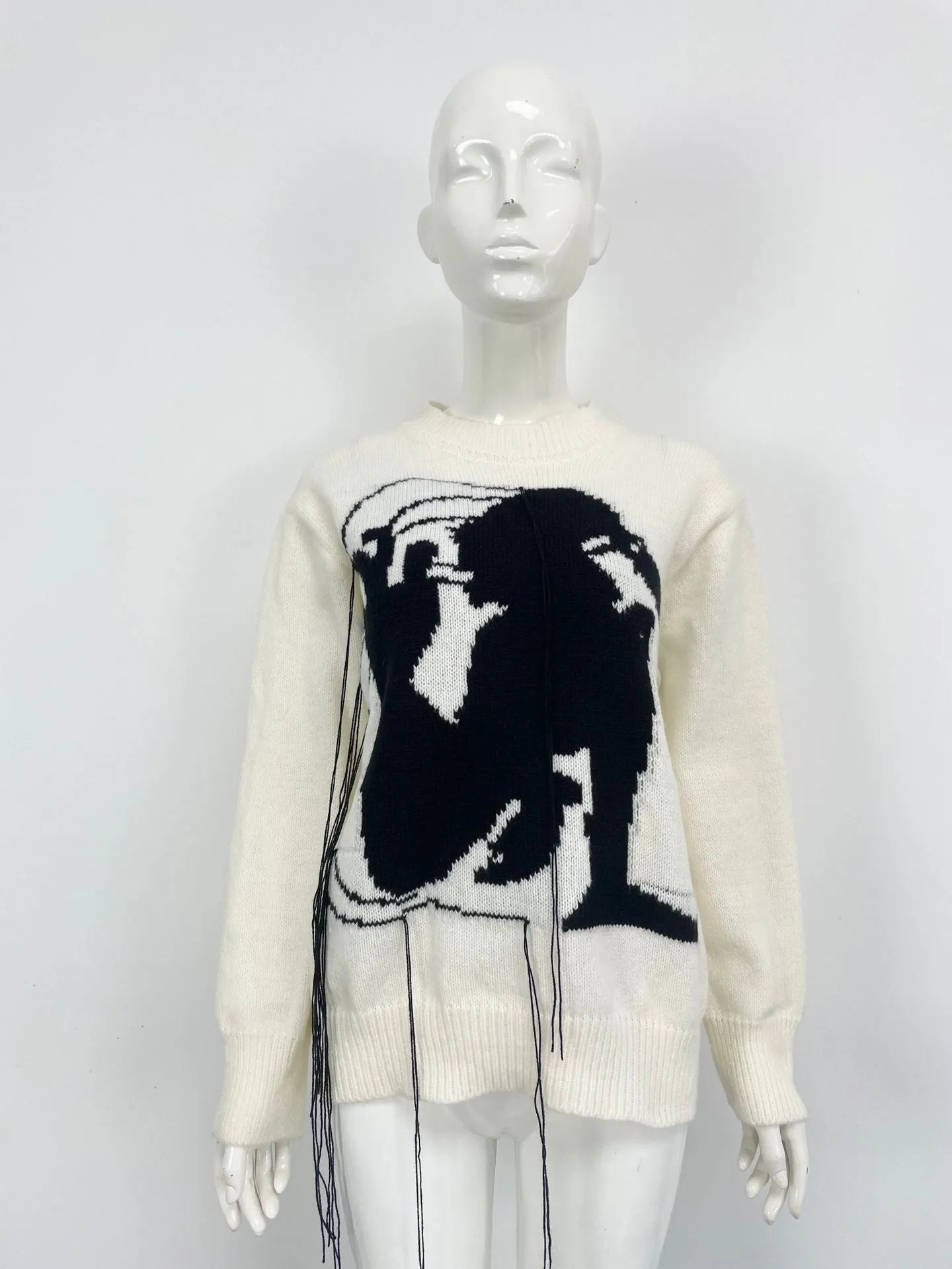 Women's grey alpaca wool sweater with tassel design and abstract pattern