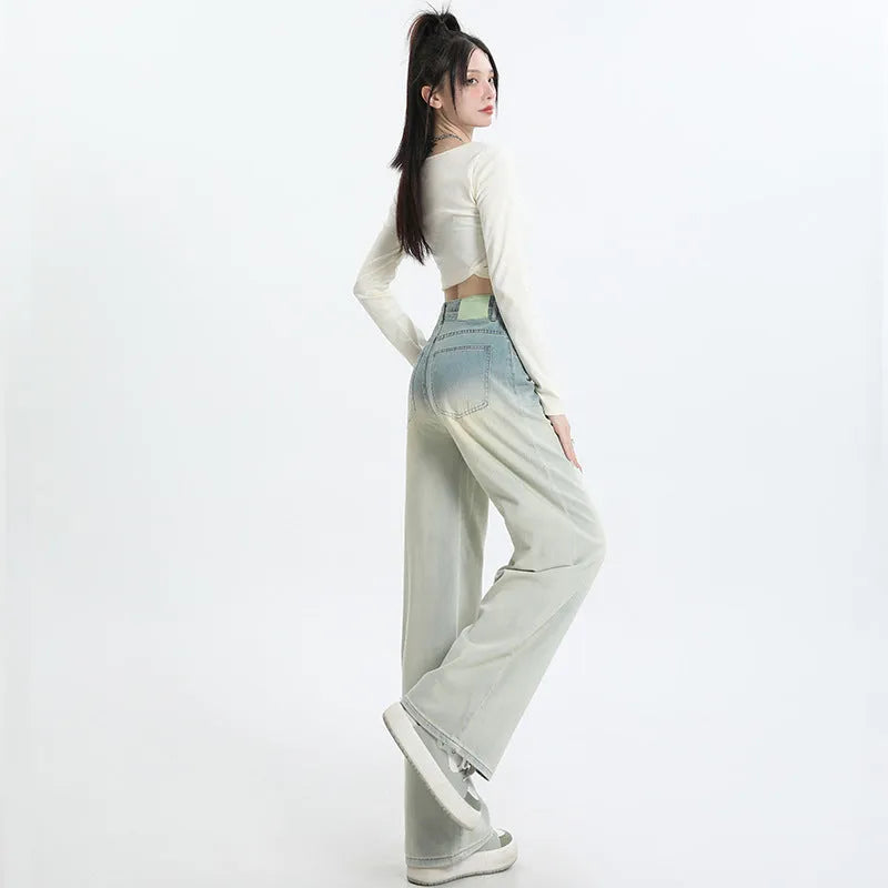 Gradient blue women's denim trousers with straight-leg cut and wider leg opening