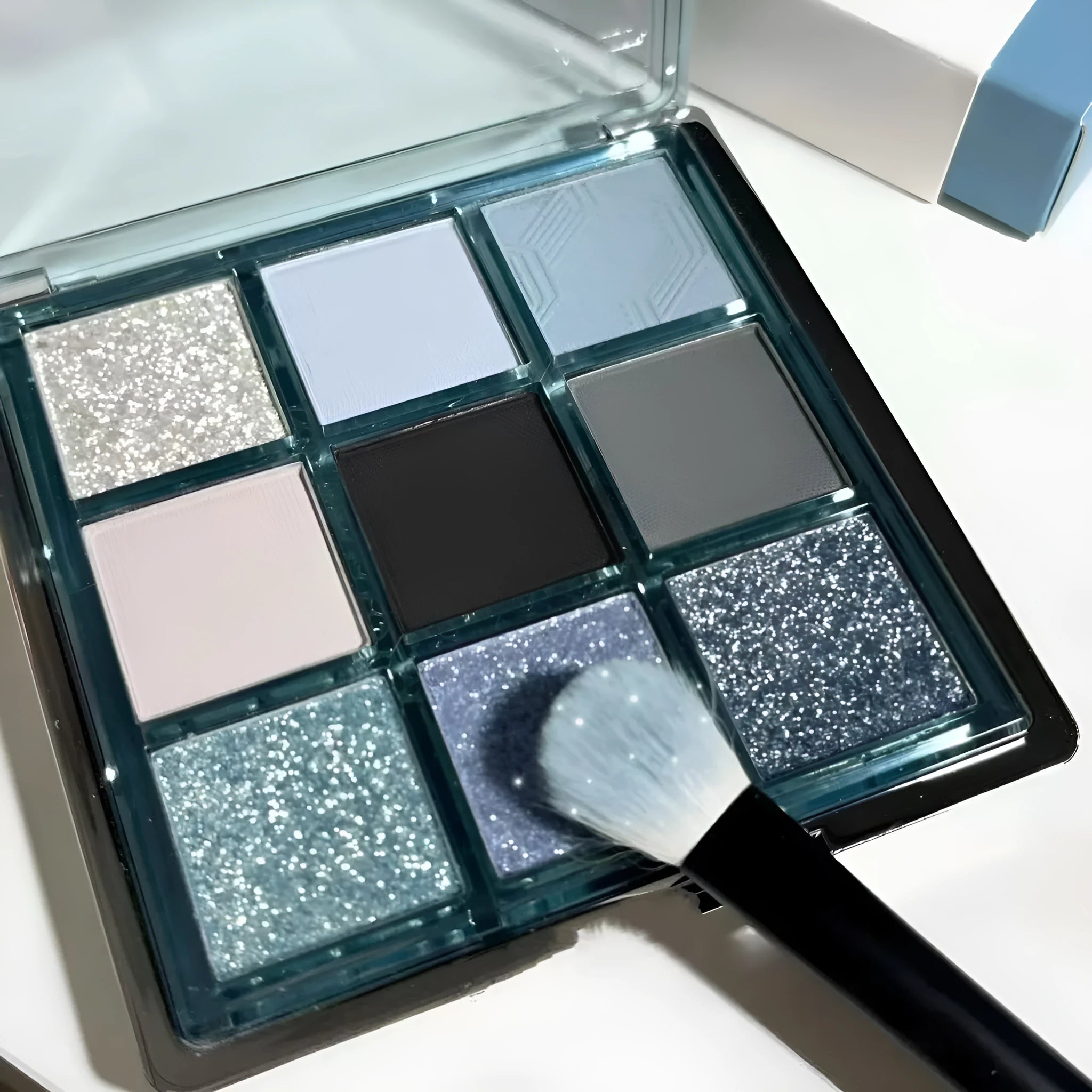 MUGELEEN nine-colour eye shadow palette shade 08 showing matte and shimmer blue smoked tones