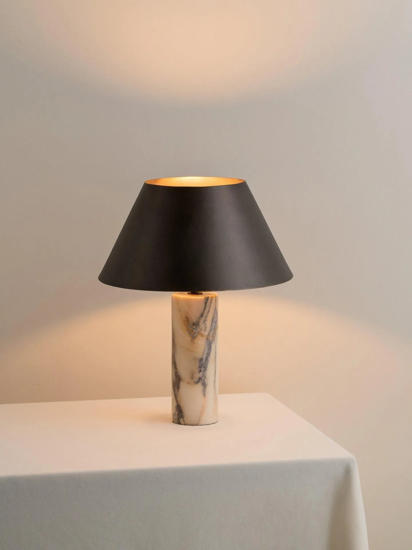 Modern black marble table lamp with minimalist design on wooden surface