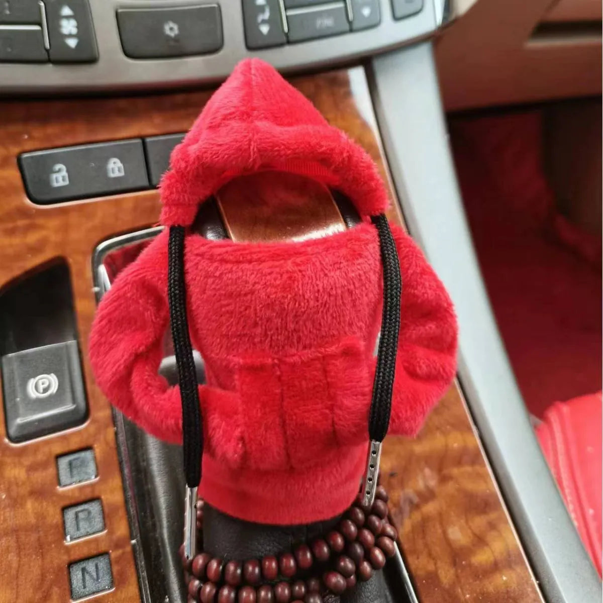 Soft Dutch velvet car gear handle cover in multiple colours on a gear stick.