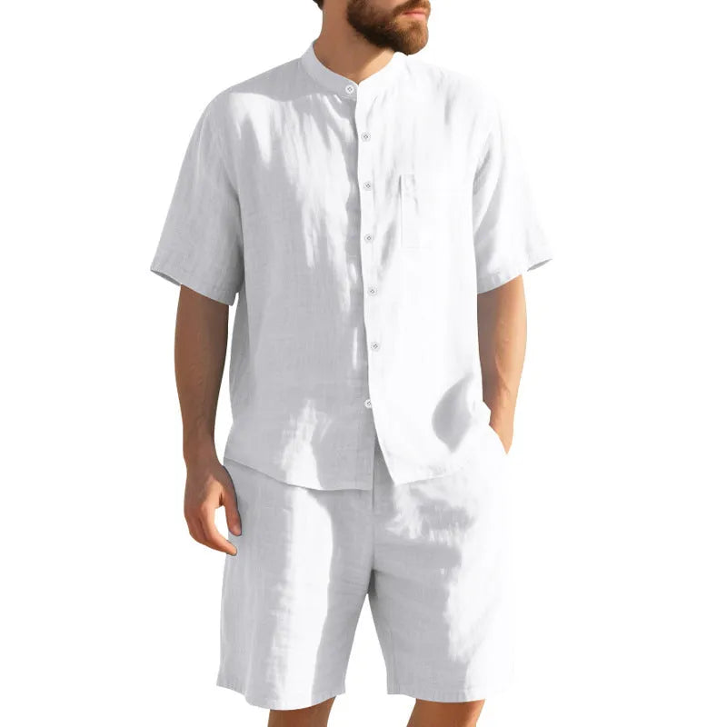 Man wearing a light blue linen blend short sleeve shirt and matching shorts, a casual summer two-piece suit.