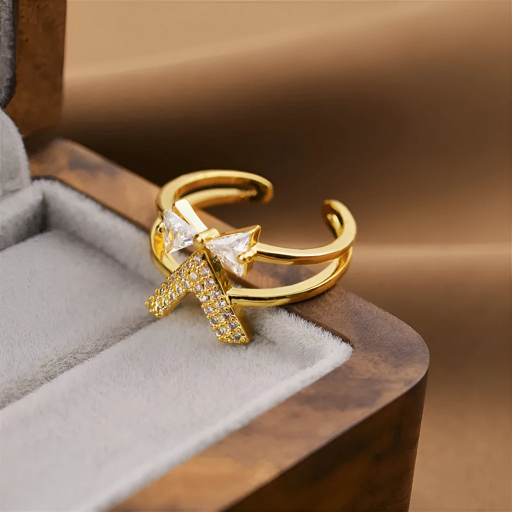 Women's geometric open ring in electroplated gold colour on a copper base.