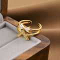 Women's geometric open ring in electroplated gold colour on a copper base.