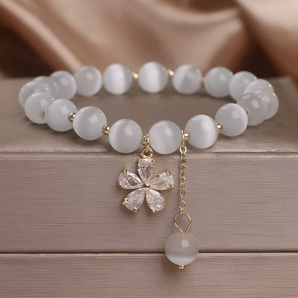 White cat's eye stone women's bracelet with flower tassels and safety buckle