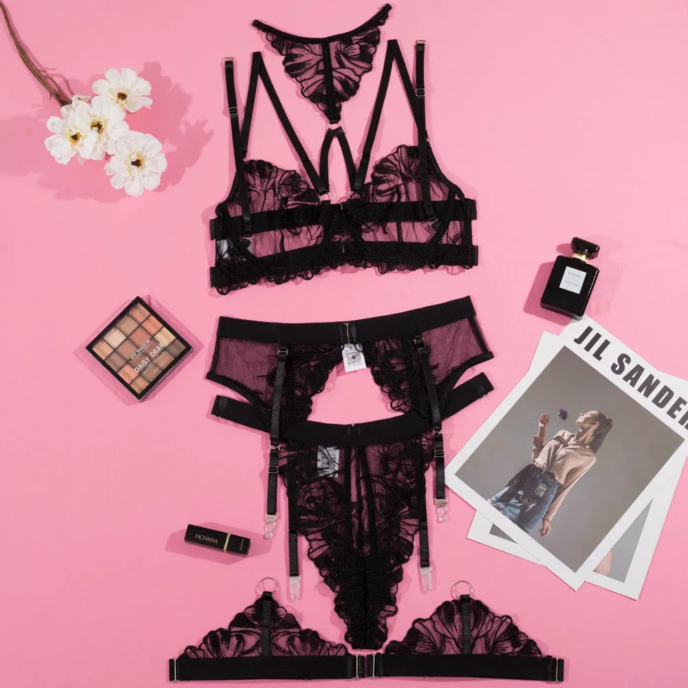 Black women's bikini set with lace embroidery on mesh, showing three-point bra and matching briefs.