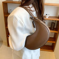 Retro dumpling-shaped women's shoulder bag in PU leather with sandwich pocket exterior