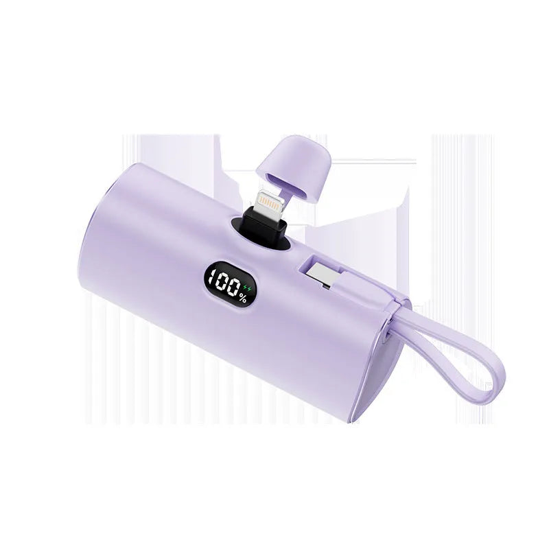 Compact rectangular power bank with digital display, showing colour options: black, white, pink, blue, green.