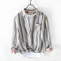 Men's loose fit striped linen shirt in red, shown on a model.