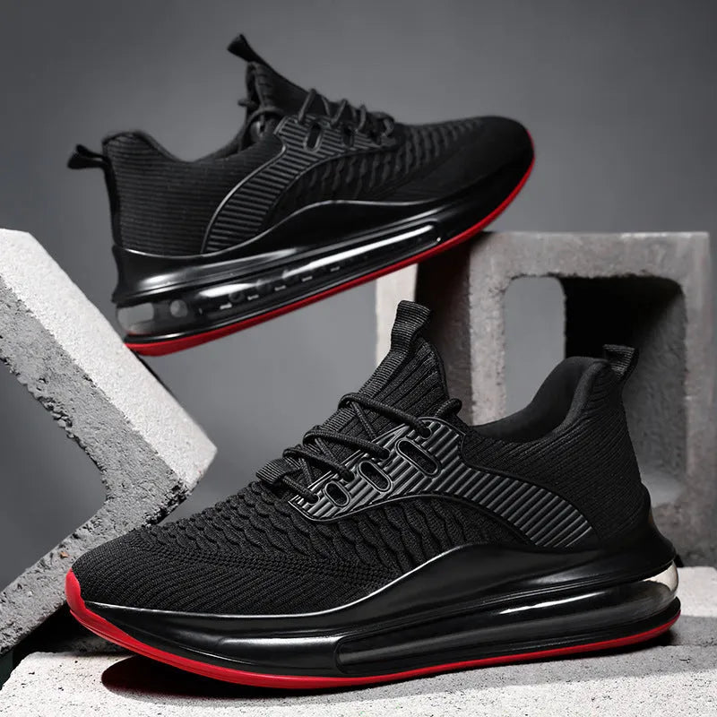 Men's low-top black mesh running sneakers with a round toe and lace-up front on a rubber sole.