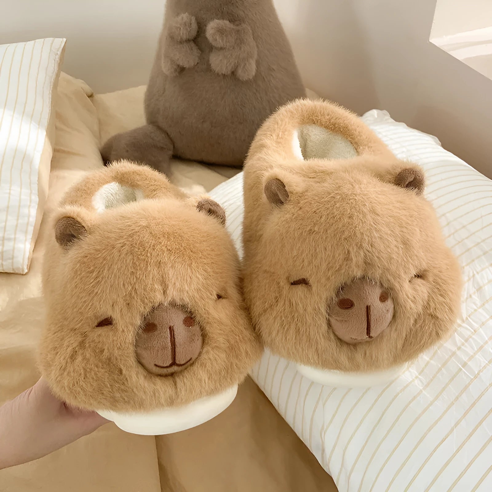 Light brown women's plush winter slippers with cartoon pattern and artificial wool lining.