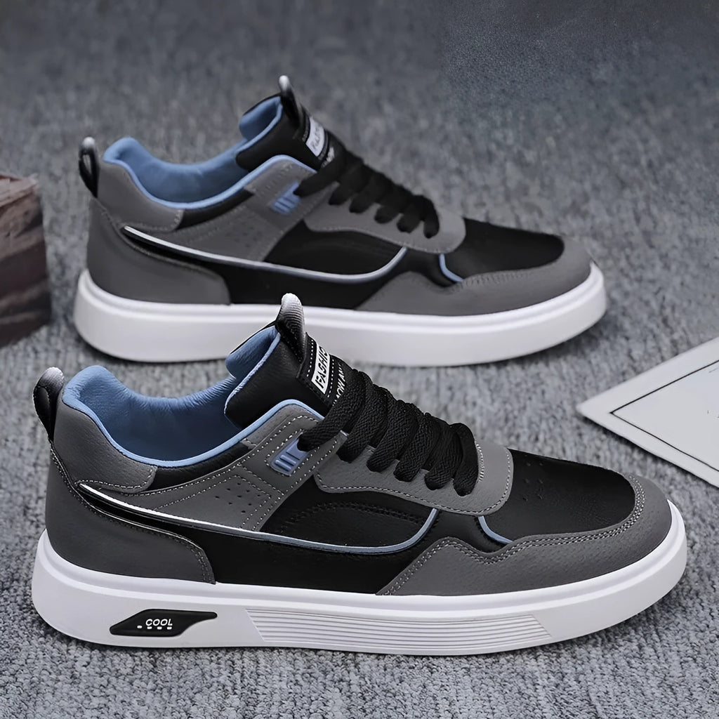 Men's low-top canvas board shoes in black with mesh lining and leather stitching detail