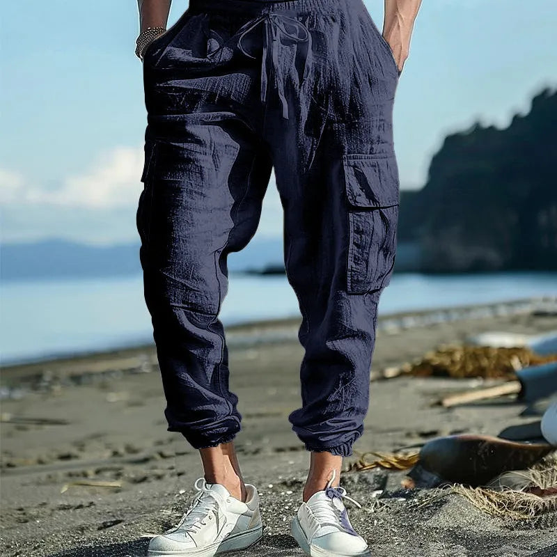 Men's linen casual trousers with drawstring waist and ankle-tied cuffs in solid colours