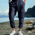 Men's linen casual trousers with drawstring waist and ankle-tied cuffs in solid colours