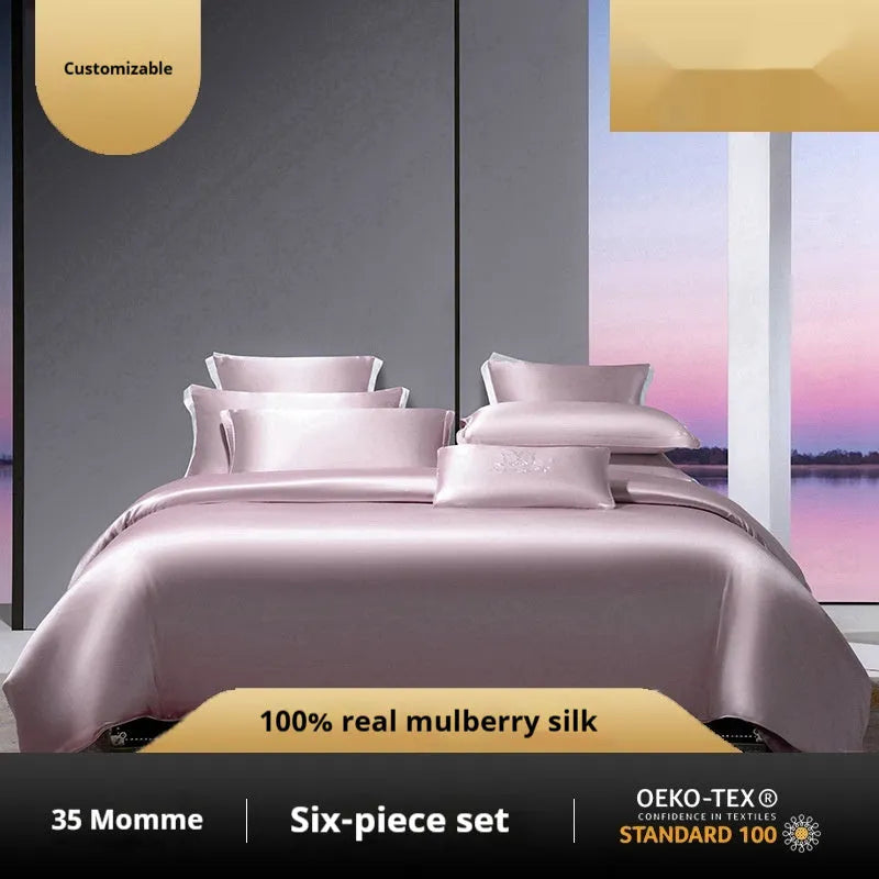 Solid colour silk quilt cover set on a bed in champagne gold, showing flat sheet and pillowcases.