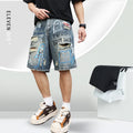 Blue ripped men's denim shorts with graffiti print and a zipper fly