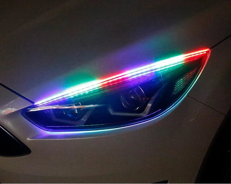 Universal LED daytime running light with remote control for General Motors cars, shown in RGB colours.