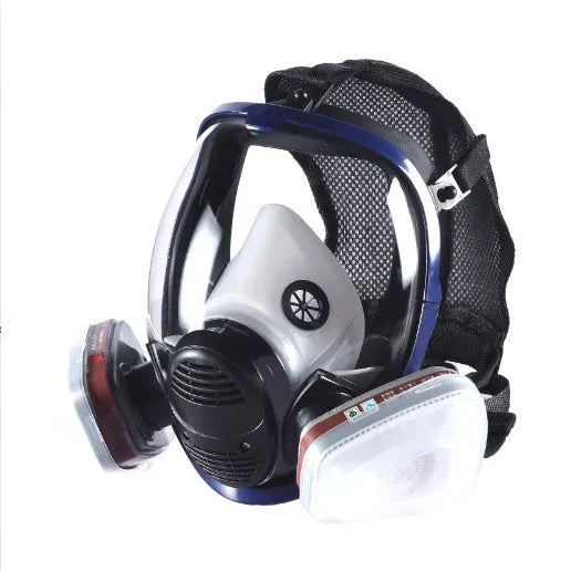 Blue-edged spherical full-face gas mask with a trapezoidal filter canister on a white background.