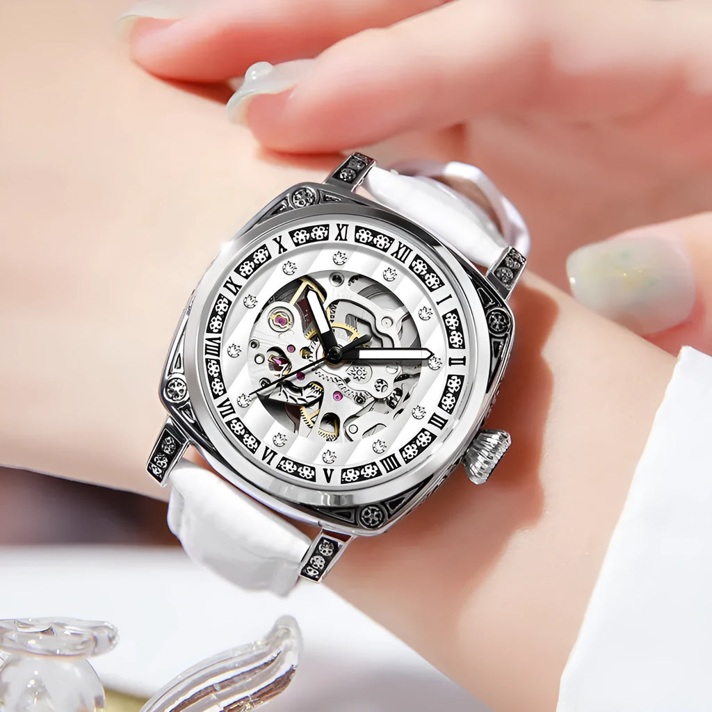 Mechanical watch with luminous hands on a leather strap, stainless steel case, shown in black colour.