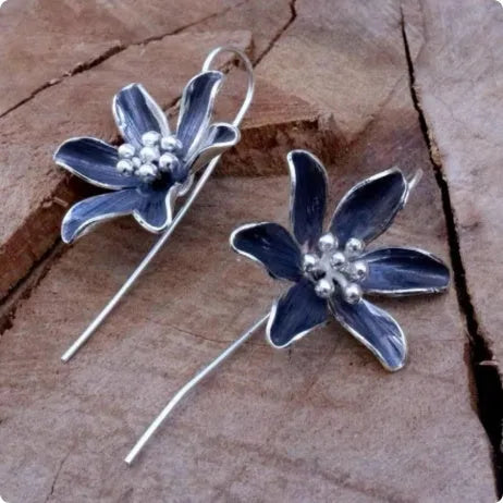 Purple flower shaped alloy earrings with electroplated finish retro design