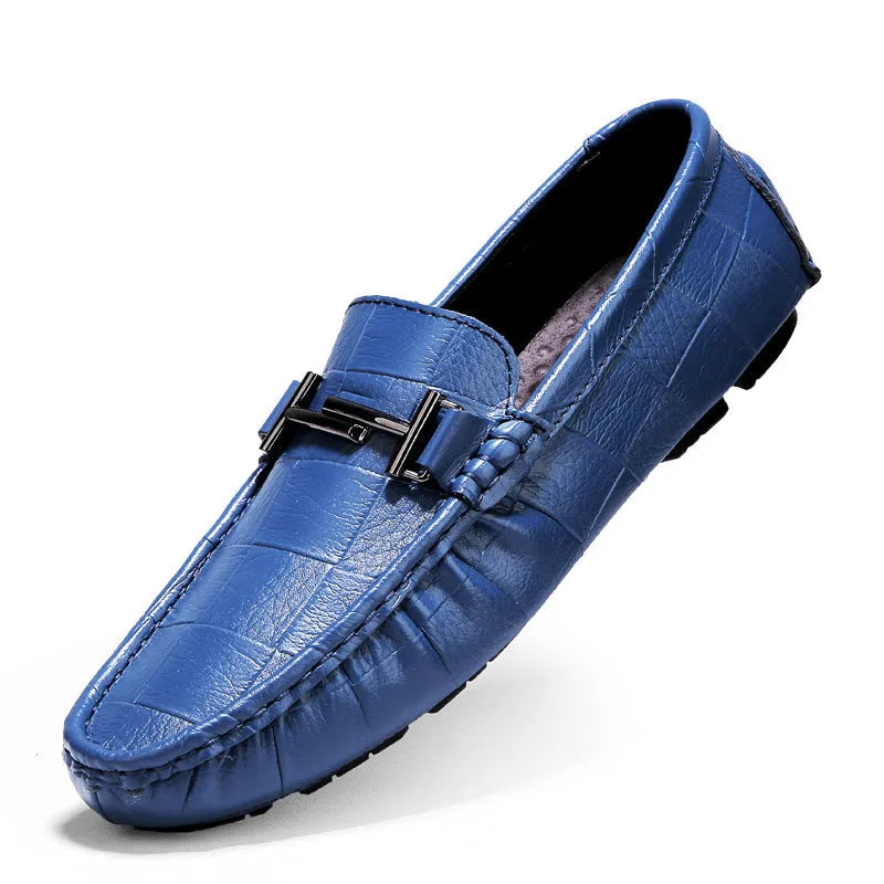 Men's black leather casual peas shoes with a belt buckle and flat rubber sole.