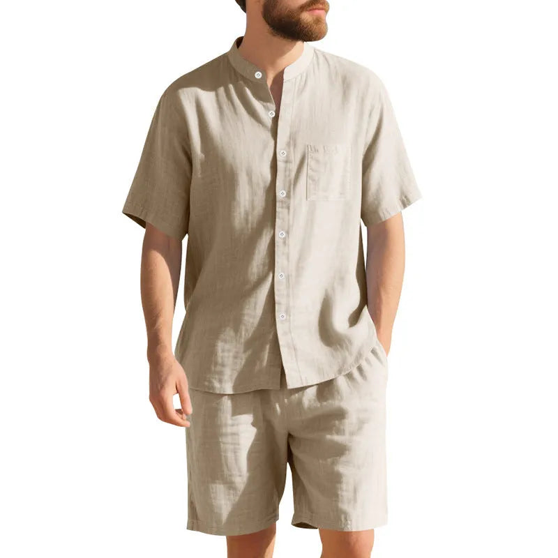 Man wearing a light blue linen blend short sleeve shirt and matching shorts, a casual summer two-piece suit.