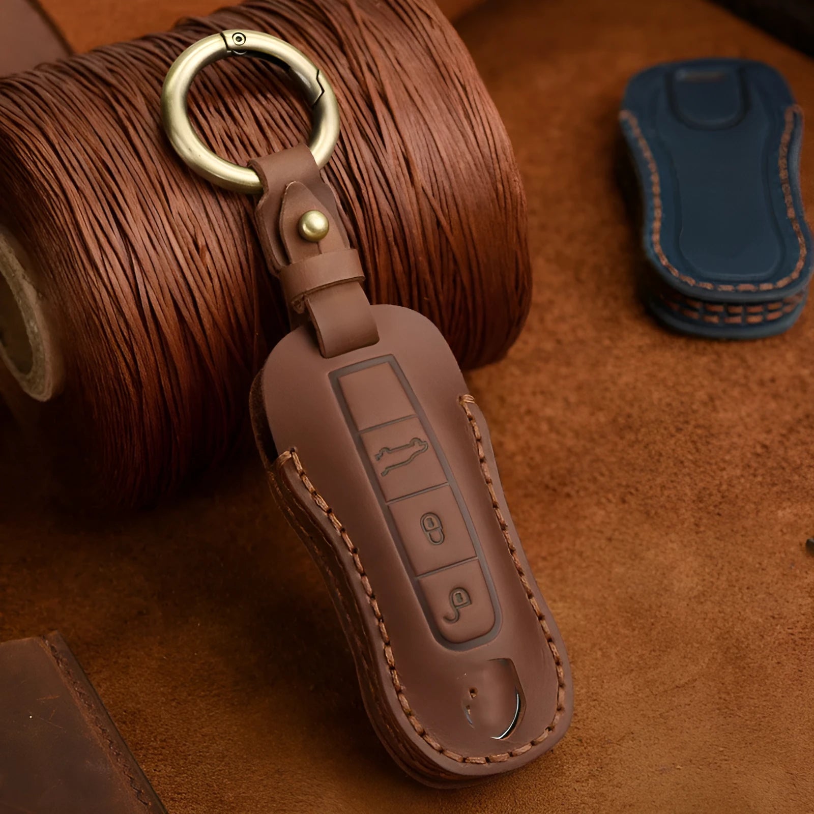Genuine cowhide leather Porsche key case with retro bag-style buckle in blue or brown colour options
