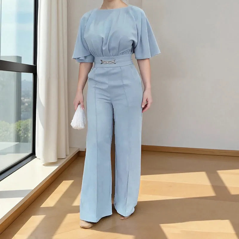 Blue men's two-piece suit with long sleeve jacket and trousers on a hanger