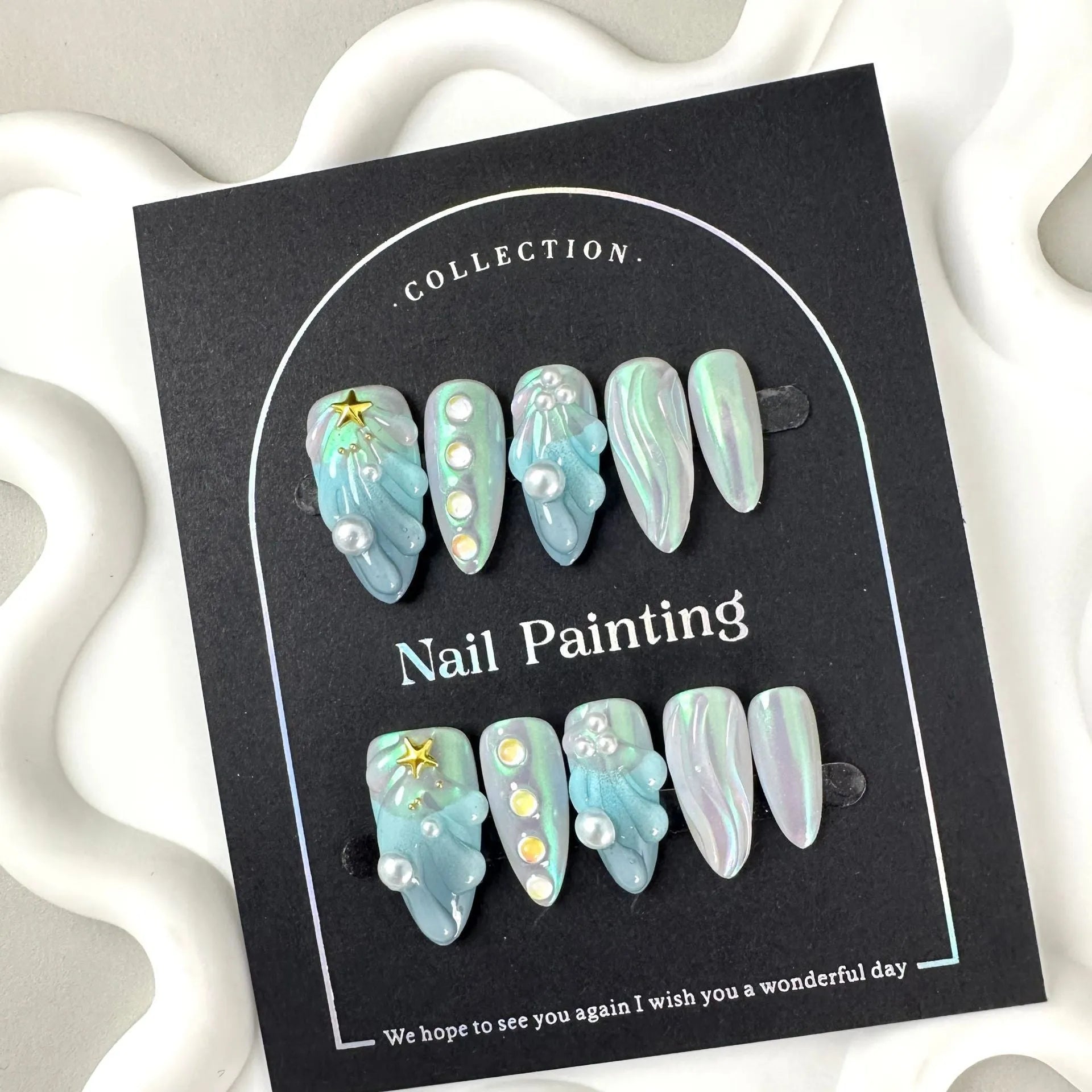 Hailang blue shell design artificial nail tips showing texture and four size options