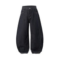 Men's original cow colour wide leg denim trousers with a mid-waist, laid flat.