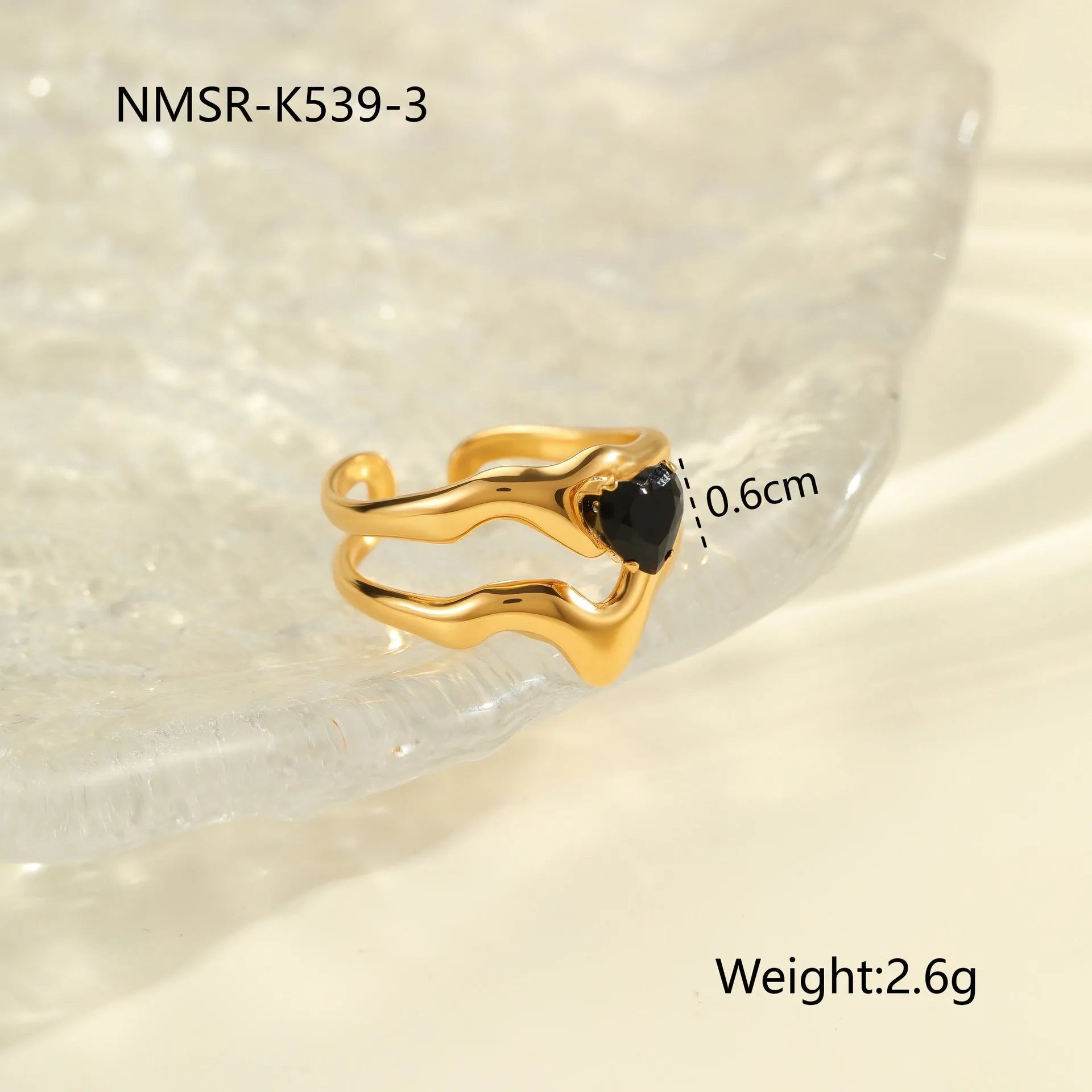 Geometric open mouth titanium steel ring for women on a plain background.