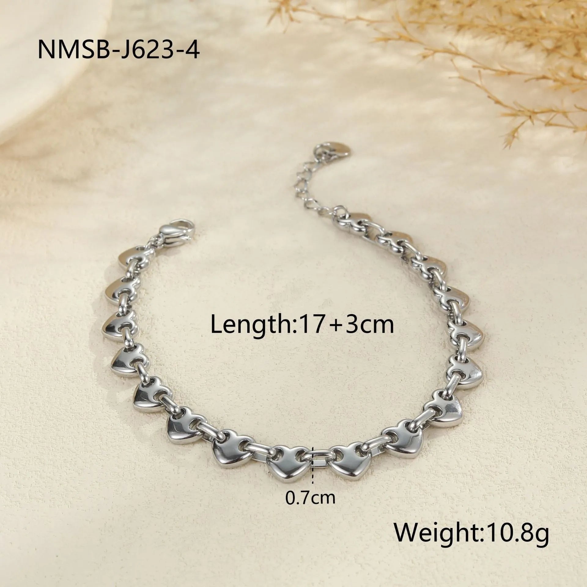 Women's hollowed-out heart bracelet in gold finish with geometric design and stainless steel construction