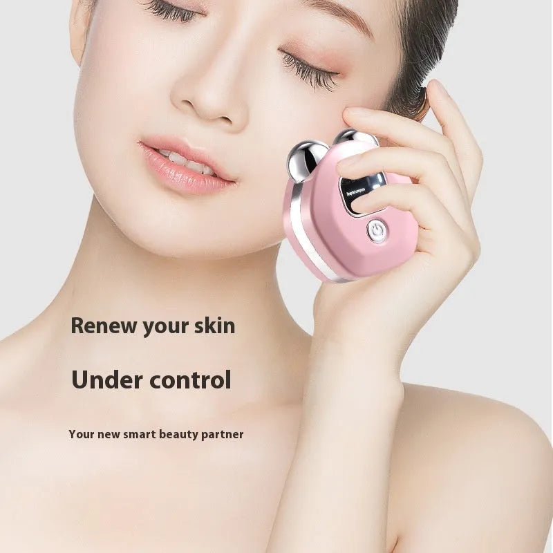 White portable hot compress massage instrument with double-roller head and charging cable