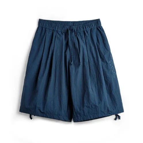 Men's loose fit Prussian Blue nylon shorts with embroidered design on leg, summer beach casual wear