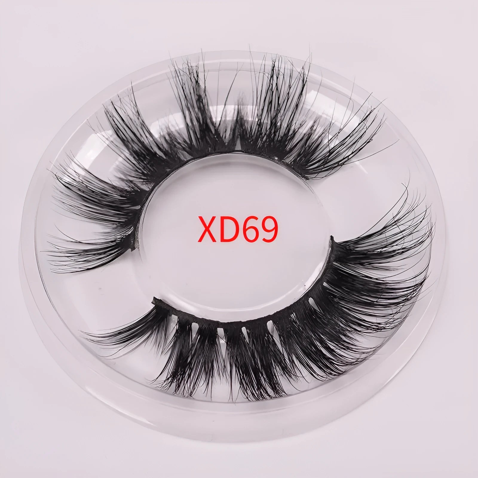 5D mink false eyelashes set with brush and storage cap on pink background